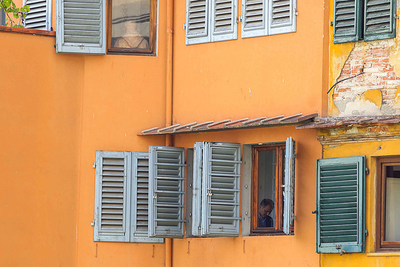 Window in France, juxtaposition of man and priest